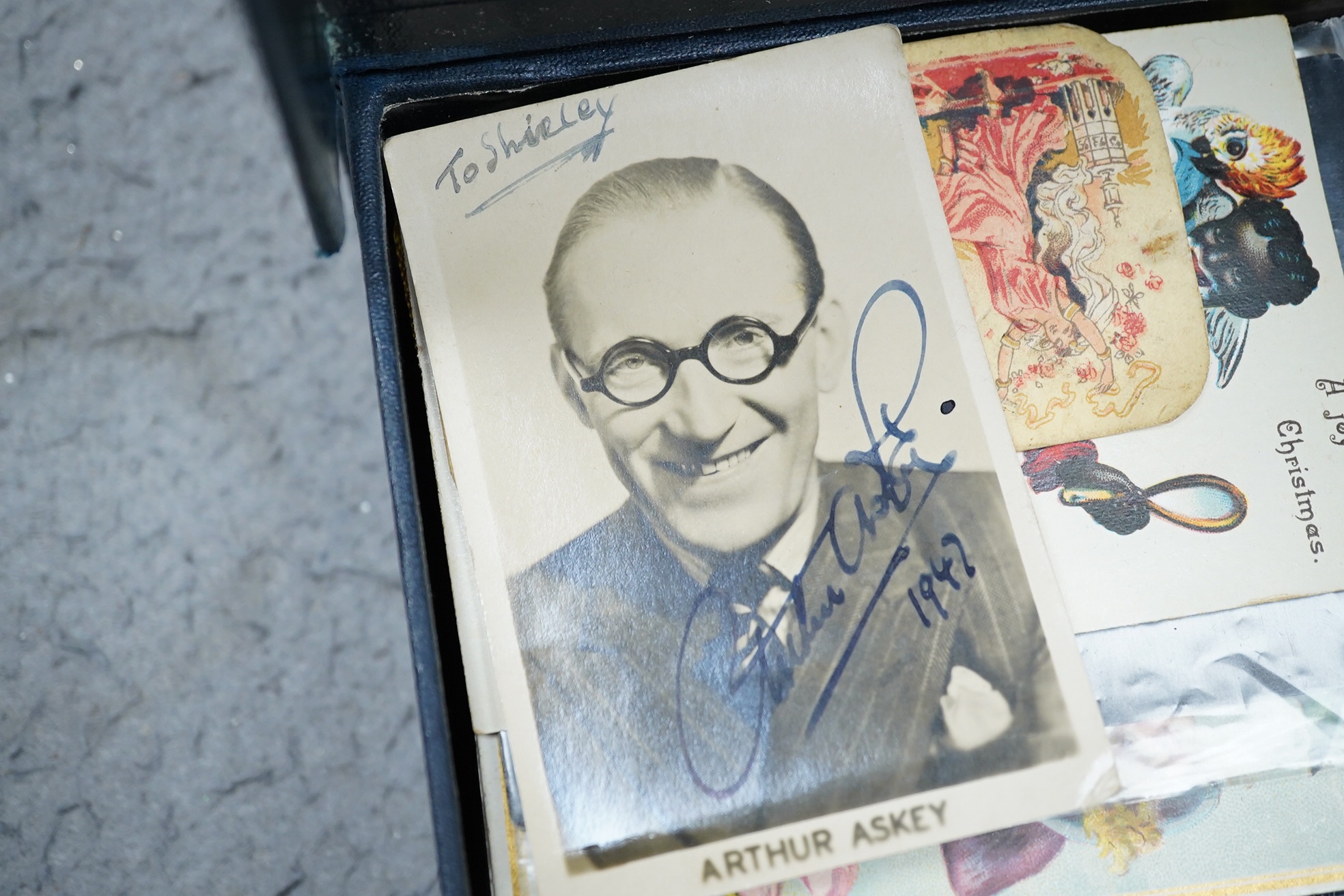 A collection of ephemera including an autographed photograph of Arthur Askey, silk cigarette card, miniature carpets, etc.